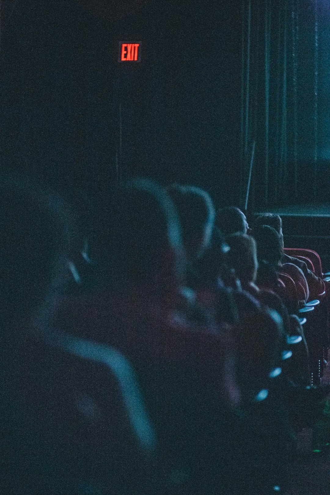 Audience of seniors seated in a theatre watching a performance