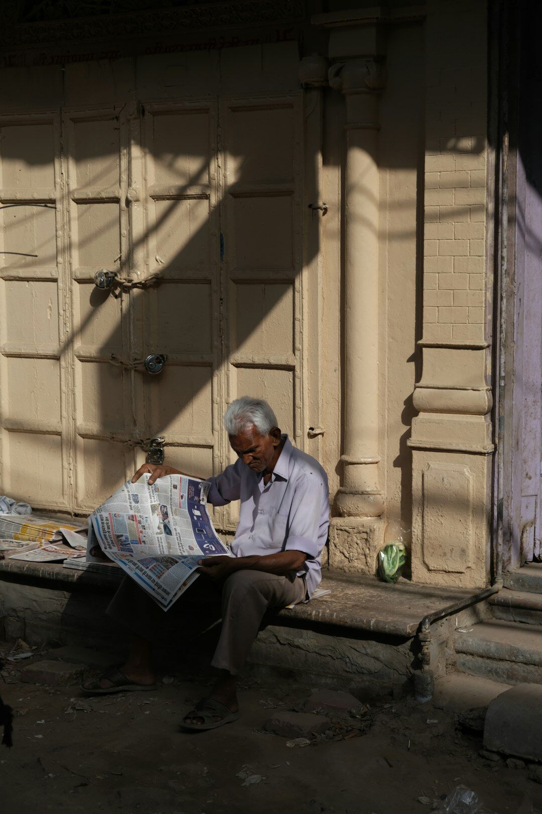 senior man reading newspaper