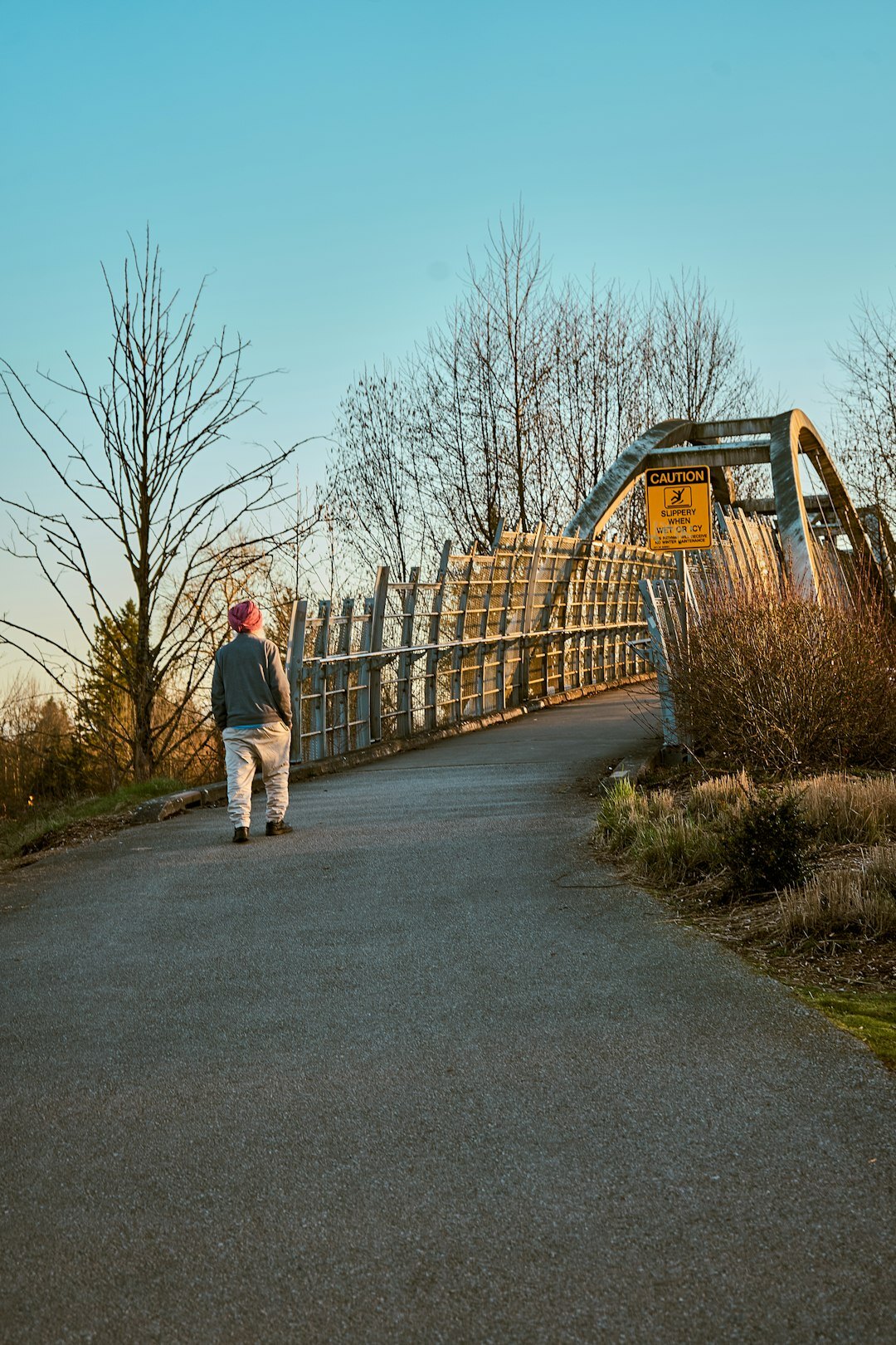elderly person walking in park