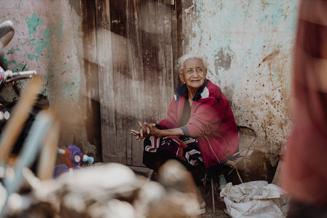 elderly woman knitting